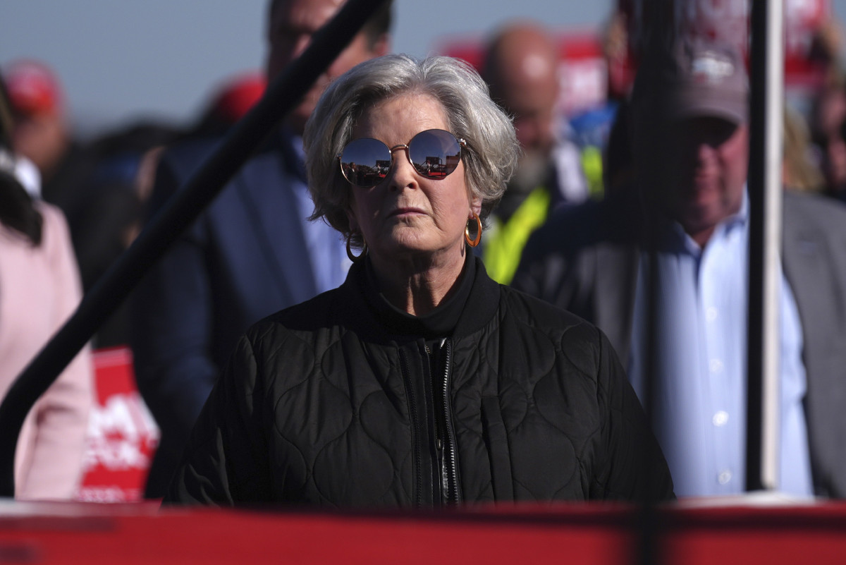 Susan Summerall Wiles standing confidently at a political event podium